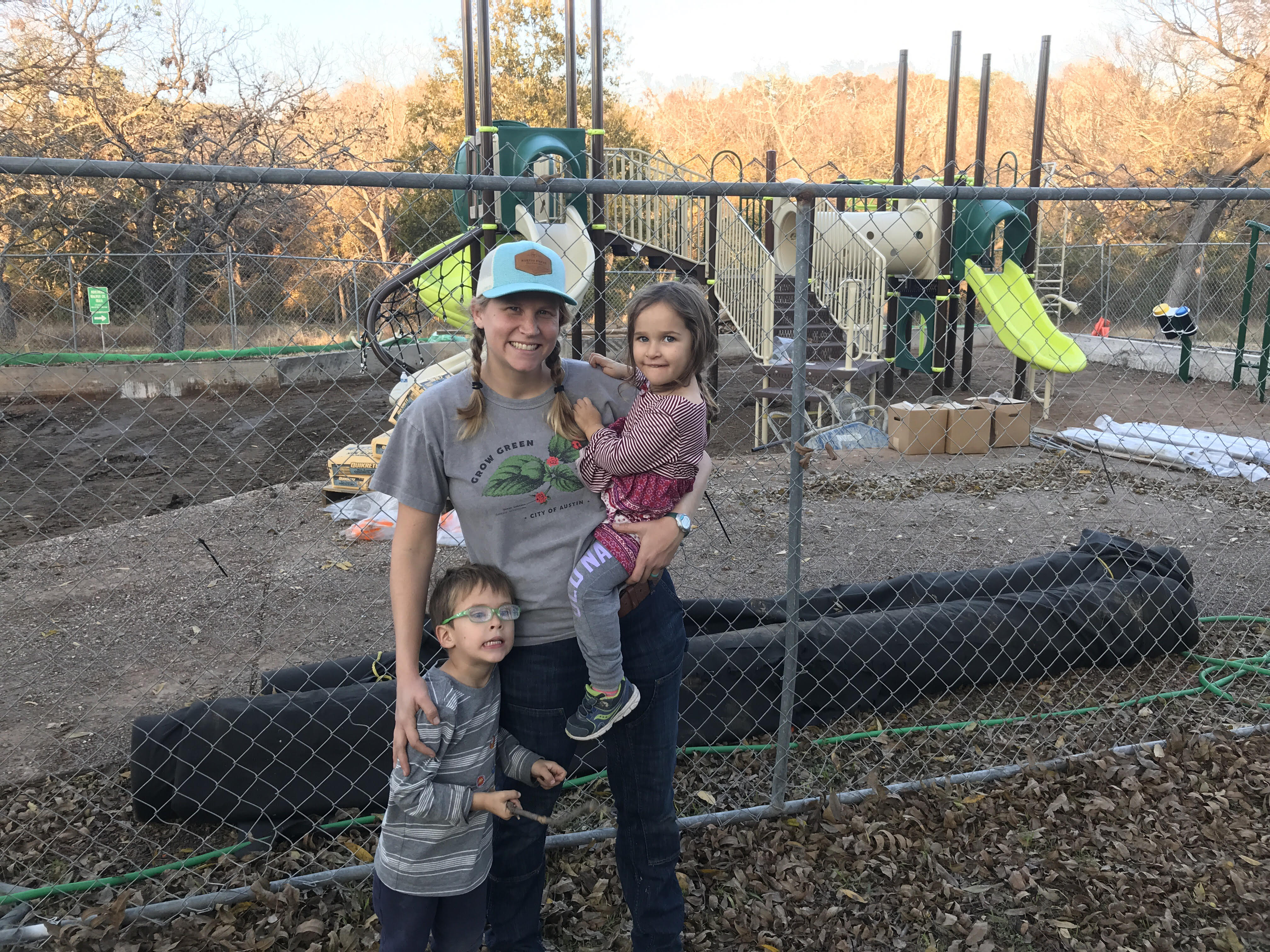 Frannie and kids in front of new playscape at Gracywoods