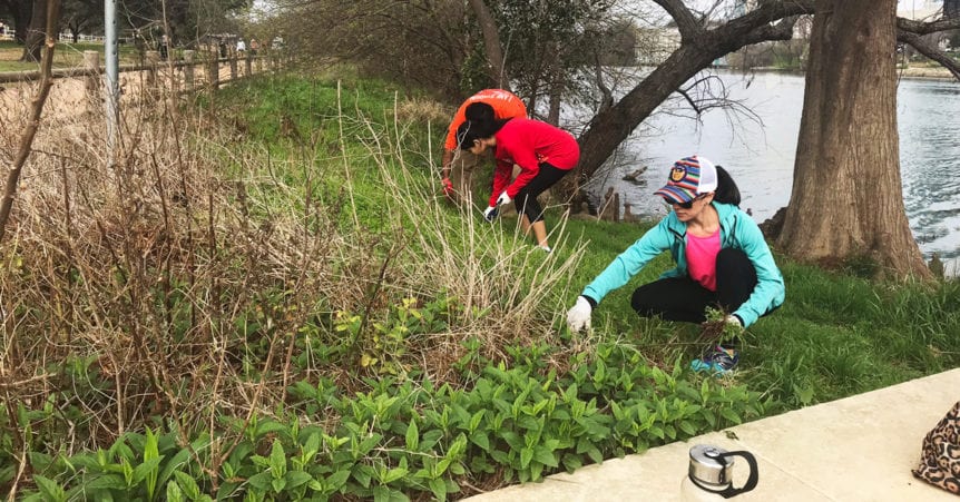 Volunteers picking up trash near the Colorado River