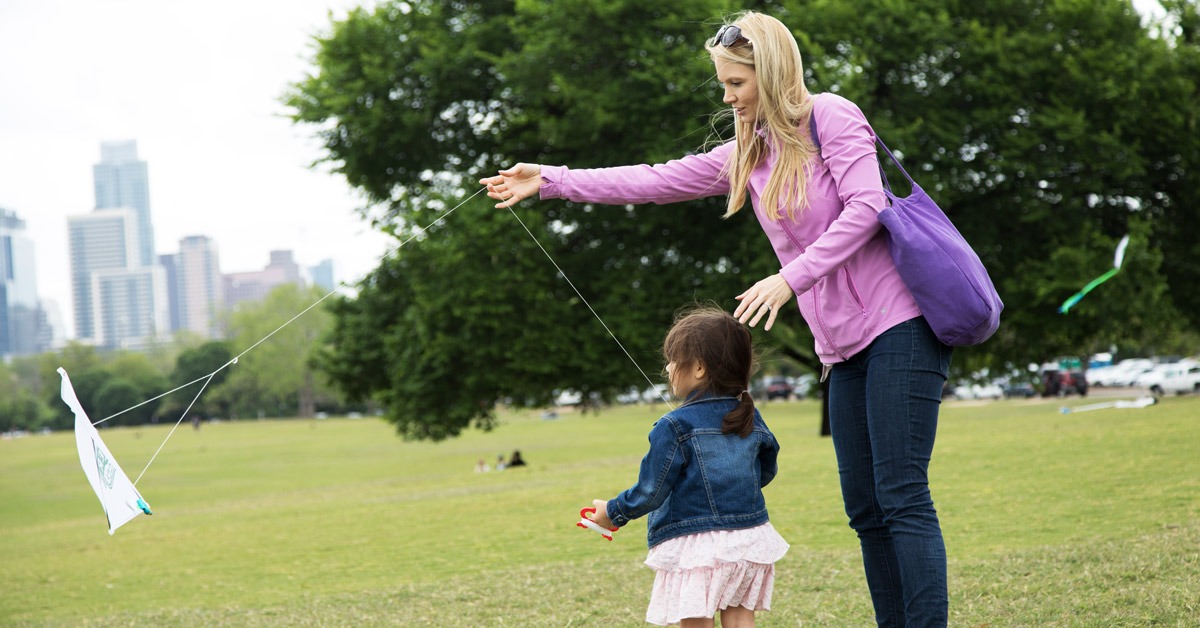 mom and daugther flying kite at zilker